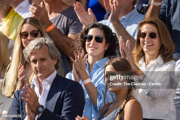 Maria Francisca Perello, wife of Rafael Nadal of Spain applauds from the team box after his victory against Casper Rudd of Norway during the Singles...