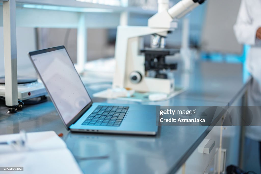Photo Of A Laptop In A Modern Laboratory