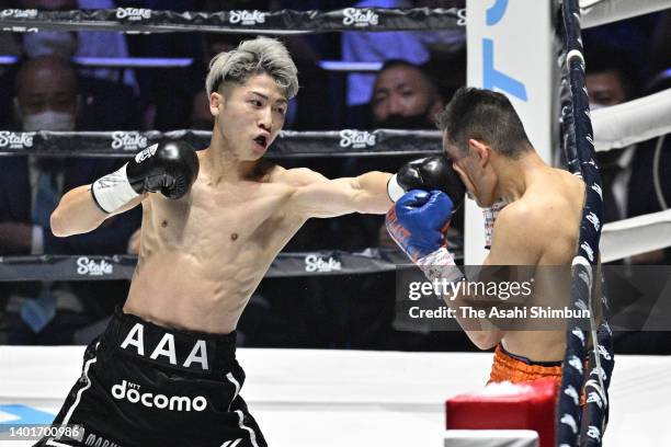 Naoya Inoue of Japan connects his left on Nonito Donaire of the Philippines in the 2nd round during the WBA/WBC/IBF Bantamweight Unification Bout at...