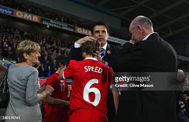 Parents of the late Gary Speed, Roger and Carol Speed and sons of the Late Gary Speed, Edward and Thomas Speed are seen with Wales manager Chris...