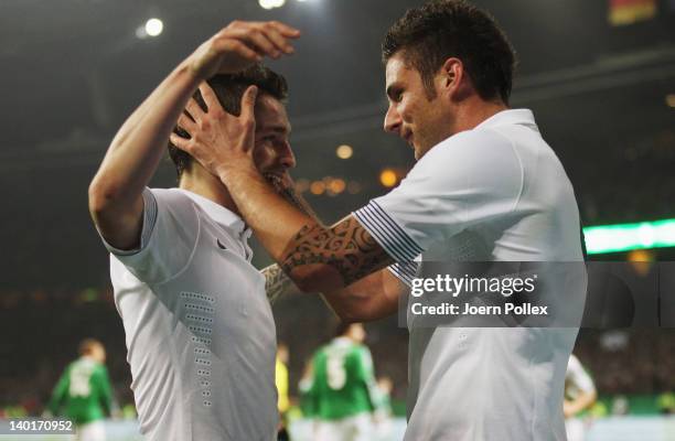 Olivier Giroud of France celebrates with his team mate Mathieu Debuchy after scoring his team's first goal during the International friendly match...