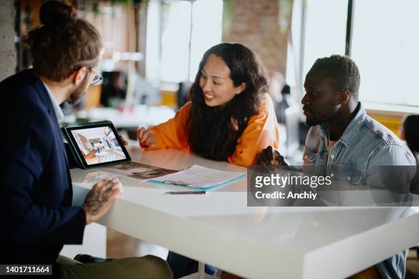 client consultation: real estate agent having a meeting with new customers - interior design professional stock pictures, royalty-free photos & images
