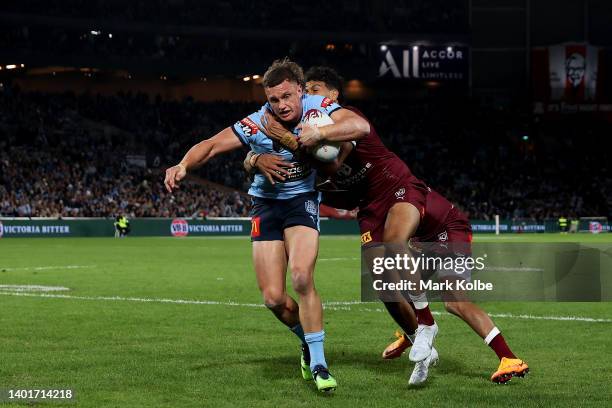 Jack Wighton of the Blues scores a try during game one of the 2022 State of Origin series between the New South Wales Blues and the Queensland...