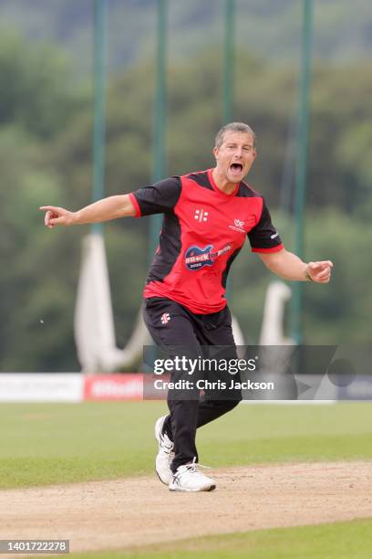 Bear Grylls celebrates during the cricket match at the Ruth Strauss Foundation's #RockforRuth event at The Wormsley Estate on June 07, 2022 in...