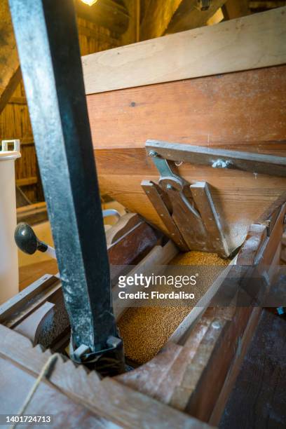 interior inside an old wooden mill. tools for work. - wasserrad stock-fotos und bilder