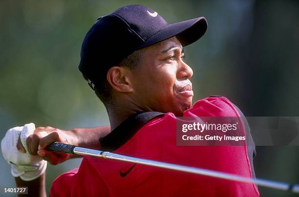 Tiger Woods watches his shot during the Asian Honda Classic at the Thai Country Club in Thailand.