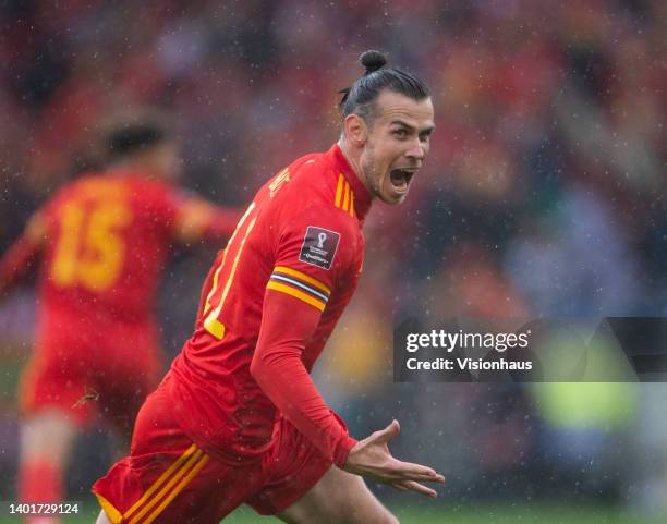 Gareth Bale of Wales celebrates their team's goal during the FIFA World Cup Qualifier between Wales and Ukraine at Cardiff City Stadium on June 05,...