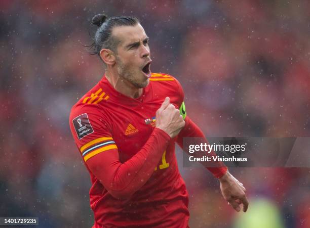 Gareth Bale of Wales celebrates their team's goal during the FIFA World Cup Qualifier between Wales and Ukraine at Cardiff City Stadium on June 05,...