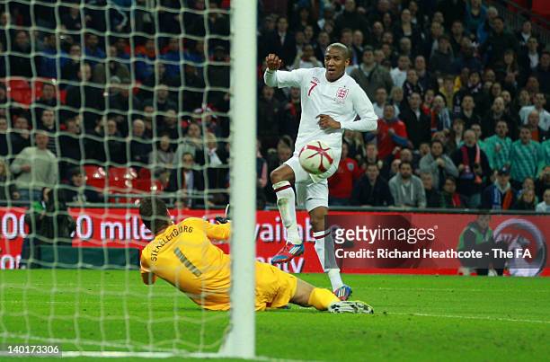 Ashley Young of England scores his team's second and equalising goal against goalkeeper Maarten Stekelenburg of Netherlands during the International...