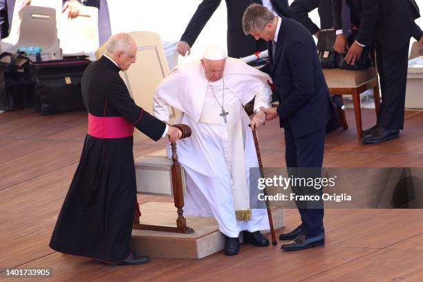 Pope Francis is helped by father Leonardo Sapienza and his personal butler Sandro Mariotti as he leaves St. Peter's Square at the end of his general...