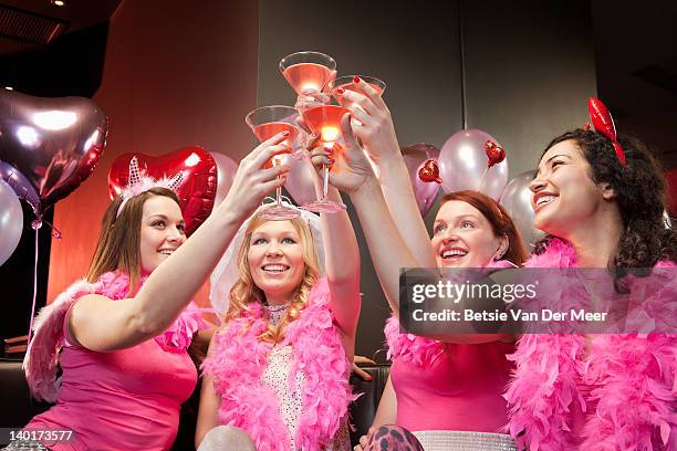 women toasting cocktails at hen night party. - addio al nubilato foto e immagini stock