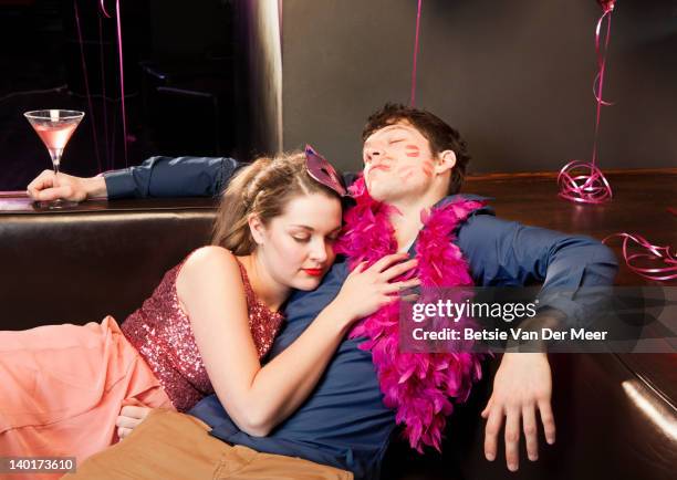 couple sleeping, exhausted at party. - hang over stock pictures, royalty-free photos & images