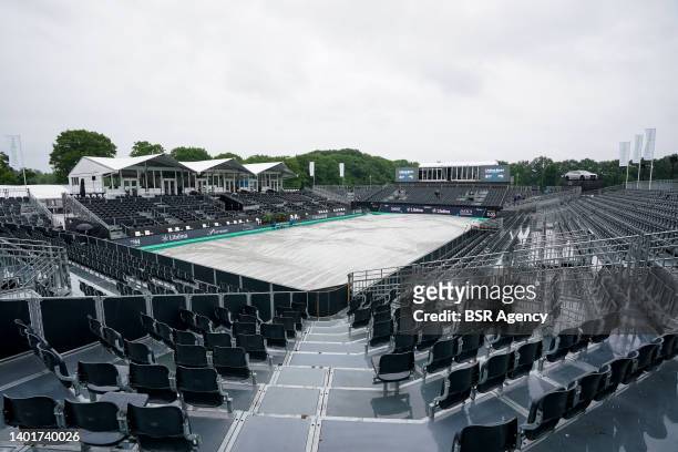 The centre court is covered while matches are suspended due to a rain delay during Day 3 of the Libema Open Grass Court Championships at the Autotron...