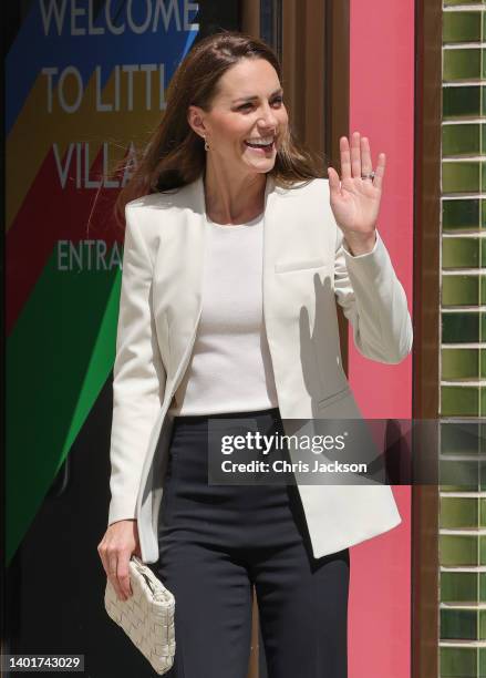 Catherine, Duchess of Cambridge waves as she departs after a visit to Little Village's hub in Brent to meet staff and hear about how the baby bank is...