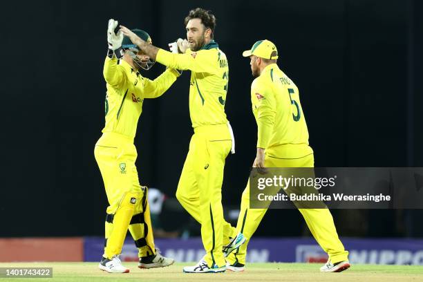 Glenn Maxwell of Australia celebrates with his teammates after taking the wicket of Pathum Nissanka of Sri Lanka during the 2nd match in the T20...