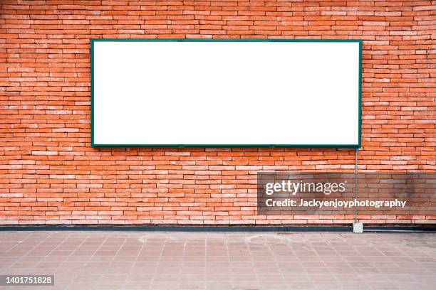 billboard banner signal mock up display on red brick wall and sidewalk - poster wall stock-fotos und bilder