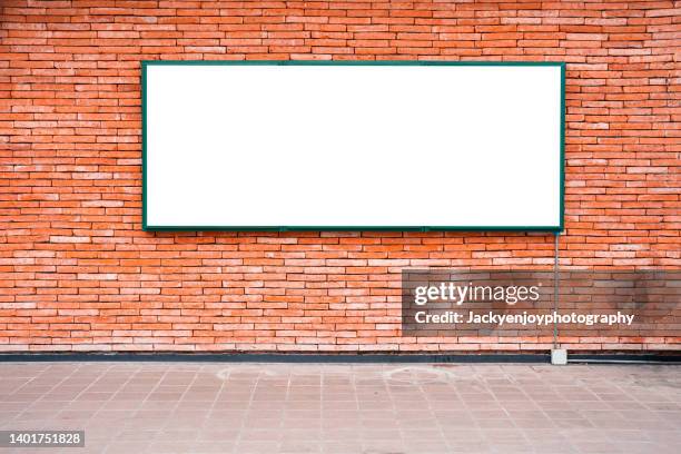 billboard banner signal mock up display on red brick wall and sidewalk - billboard wall stock pictures, royalty-free photos & images