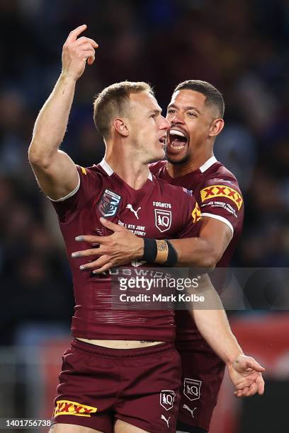Daly Cherry-Evans of the Maroons celebrates with Dane Gagai of the Maroons scoring a try during game one of the 2022 State of Origin series between...
