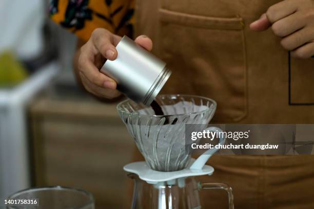 barista woman dripping coffee and slow coffee bar style - coffee drip ストックフォトと画像