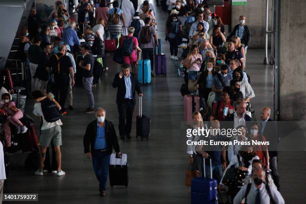 Several people wait in line for cabs at Terminal 4 of the Adolfo Suarez Madrid-Barajas airport, June 8 in Madrid, Spain. The Government has announced...
