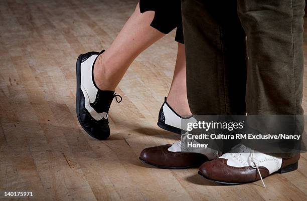 close up of older couples dancing shoes - swing dancing stock-fotos und bilder