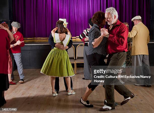 older couples dancing in auditorium - ballroom fotografías e imágenes de stock