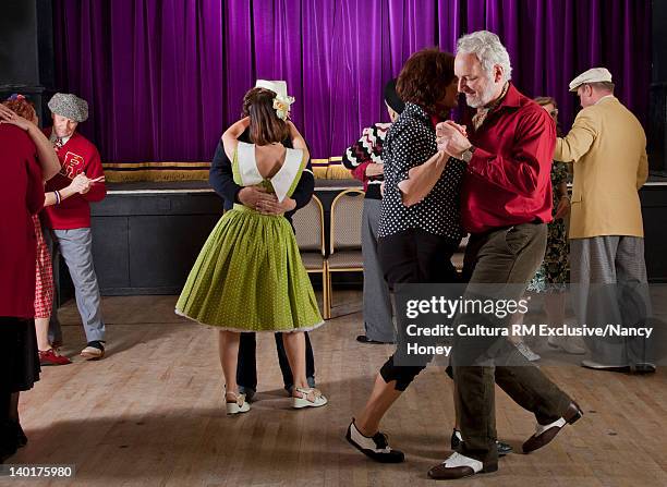 older couples dancing in auditorium - danssalong bildbanksfoton och bilder