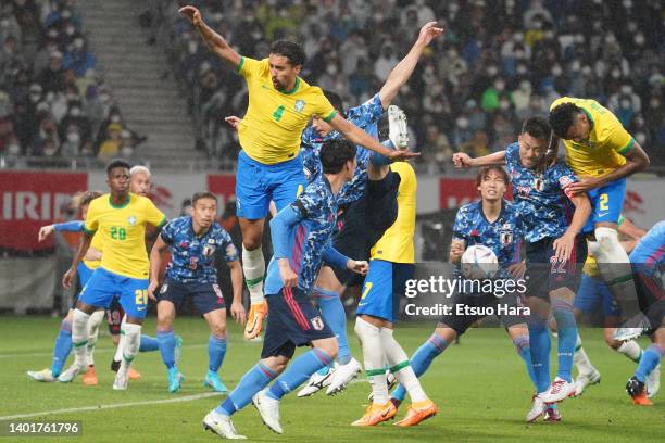 Maya Yoshida of Japan and Eder Militao of Brazil compete for the ball during the international friendly match between Japan and Brazil at National...