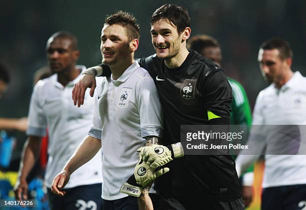 Hugo lloris and Mathieu Debuchy of France celebrate after the International friendly match between Germany and France at Weser Stadium on February...
