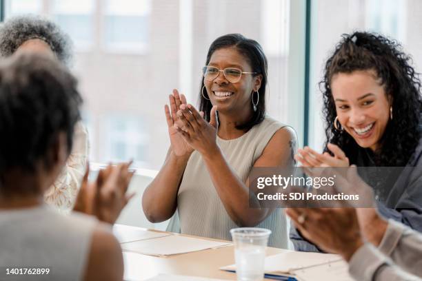 diverse group meets for book club - black leadership stock pictures, royalty-free photos & images