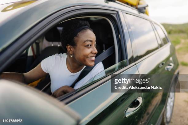 enjoying my road trip - driving herself stock pictures, royalty-free photos & images
