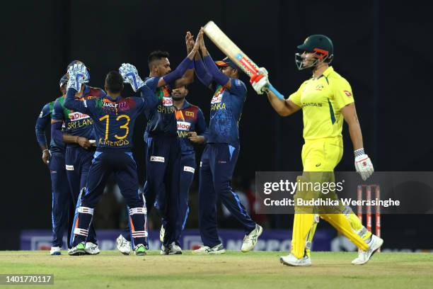 Dushmantha Chameera celebrates with teammates after taking the wicket Marcus Stoinis of Australia during the 2nd match in the T20 International...