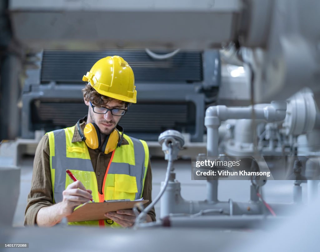 Heavy Industry Engineers working at Manufacturing Factory or power plant.