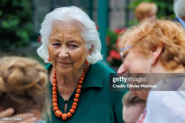 Queen Paola talks with laureats during the Queen Paola Prize for Education 2021-2022 distribution on June 8, 2022 in the Royal Castle’s Orangerie in...