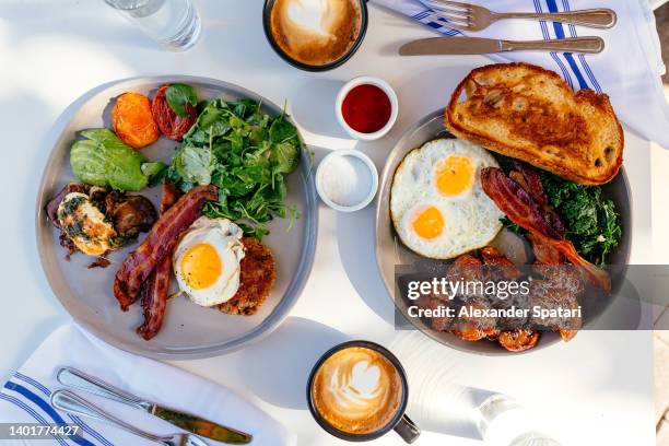 breakfast for two persons served in a restaurant, directly above view - ontbijt stockfoto's en -beelden