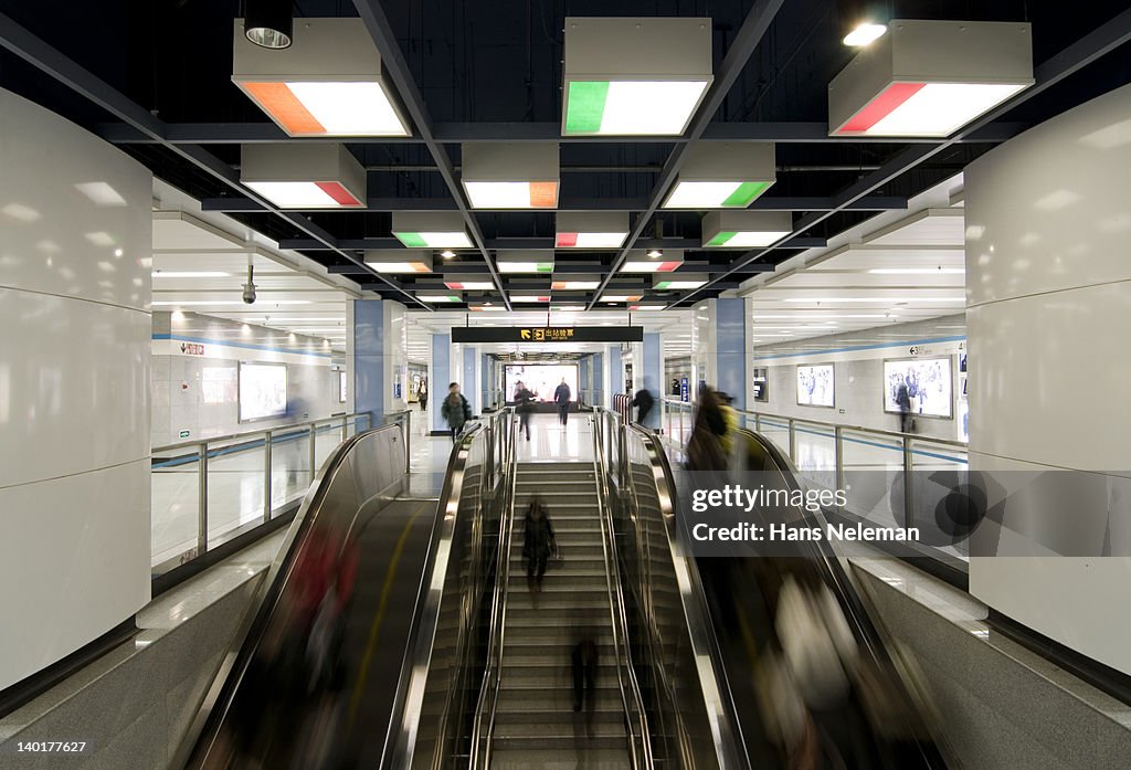 China, Shanghai, escalator of subway station at rush hour