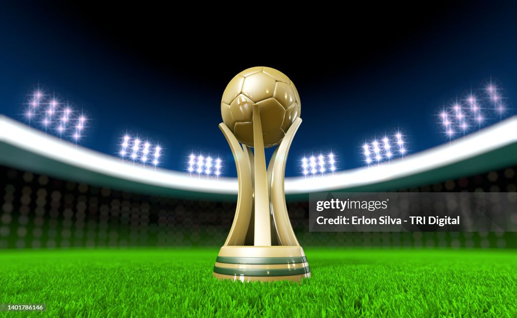 Soccer trophy on stadium lawn with copy space