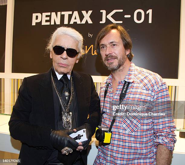 Marc Newson and Karl lagerfeld attend the Marc Newson & Pentax: The Unveiling Of 'K-01' Champagne Cocktail At Colette during Paris Fashion Week at...