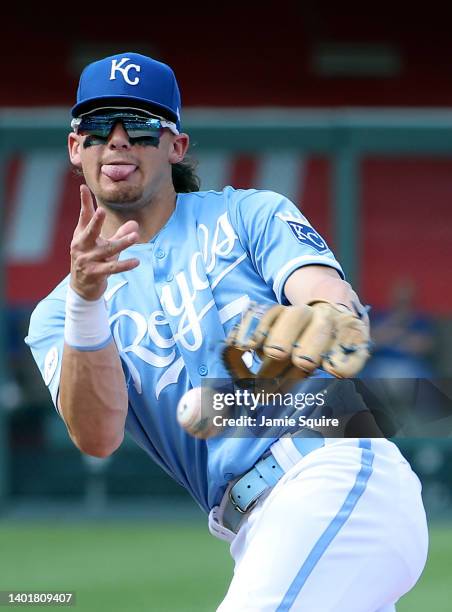 Bobby Witt Jr. #7 of the Kansas City Royals throws towards first base after fielding a ground ball during the 9th inning of the game against the...