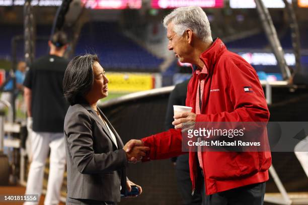 President of Baseball Operations Dave Dombrowski of the Philadelphia Phillies talks with general manager Kim Ng of the Miami Marlins prior to the...