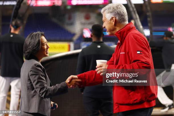 President of Baseball Operations Dave Dombrowski of the Philadelphia Phillies talks with general manager Kim Ng of the Miami Marlins prior to the...