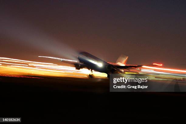 commercial airplane - long exposure plane stock pictures, royalty-free photos & images