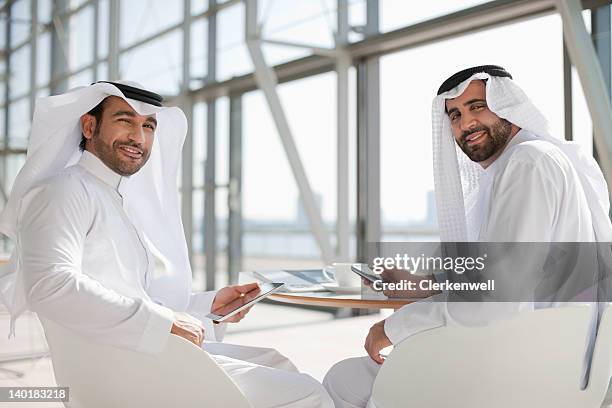 portrait of smiling businessmen in kaffiyehs - arab coffee stock pictures, royalty-free photos & images