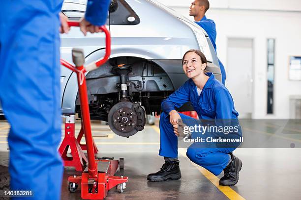 mechanics working in auto repair shop - jack stock pictures, royalty-free photos & images