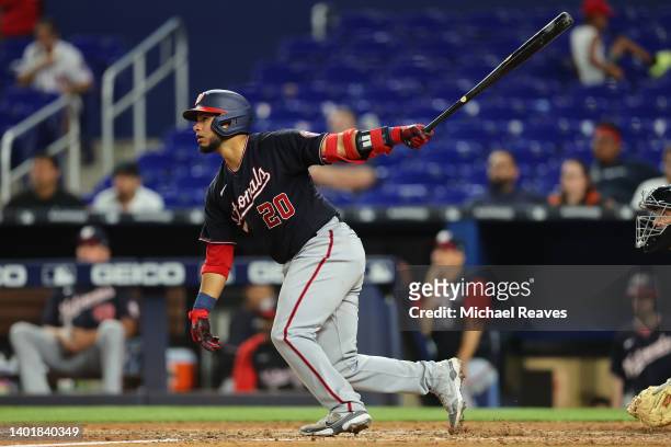 Keibert Ruiz of the Washington Nationals hits a RBI single during the tenth inning against the Miami Marlins at loanDepot park on June 08, 2022 in...