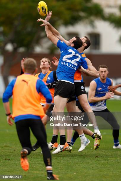 Tristan Xerri and Todd Goldstein of the Kangaroos compete during a North Melbourne Kangaroos AFL training session at Arden Street Ground on June 09,...