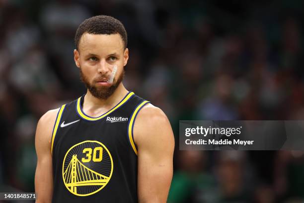 Stephen Curry of the Golden State Warriors looks on in the fourth quarter against the Boston Celtics during Game Three of the 2022 NBA Finals at TD...