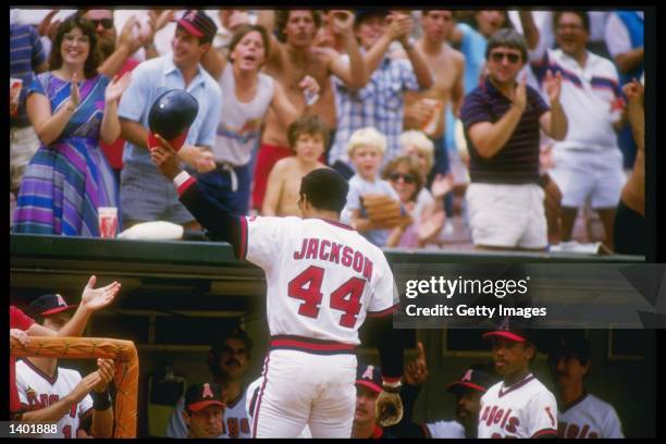 Reggie Jackson of the California Angels waves to the crowd during a game at Anaheim Stadium in Anaheim, California. Mandatory Credit: Allsport...