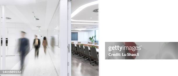 business colleagues in motion past office conference room. - walking past office wall stock pictures, royalty-free photos & images