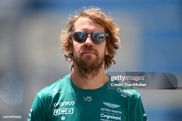 Sebastian Vettel of Germany and Aston Martin F1 Team walks in the Paddock during previews ahead of the F1 Grand Prix of Azerbaijan at Baku City...